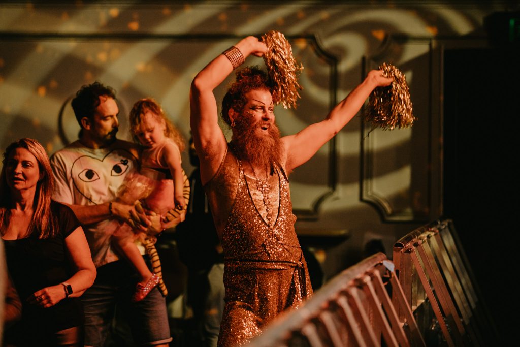 Dandrogn performs at The Last Dance by All The Queens Men for Fuse Festival. They are dress in gold shaking gold poms poms and look fantastic. Image by Wild Hardt.