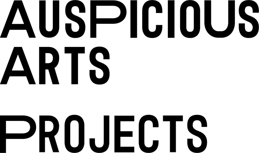 A three large, easily legible word logo for Auspicious Arts Projects. Black text on darker colour background.